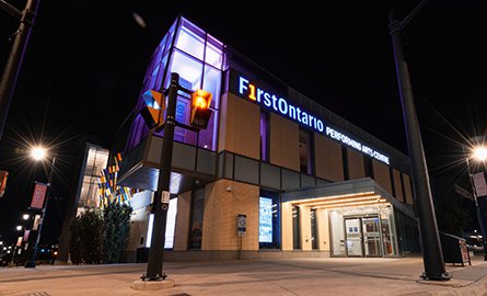 An illuminated modern building at night