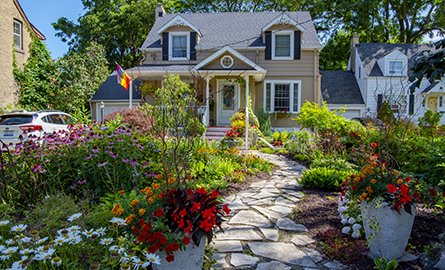 A house with flowers planted in front