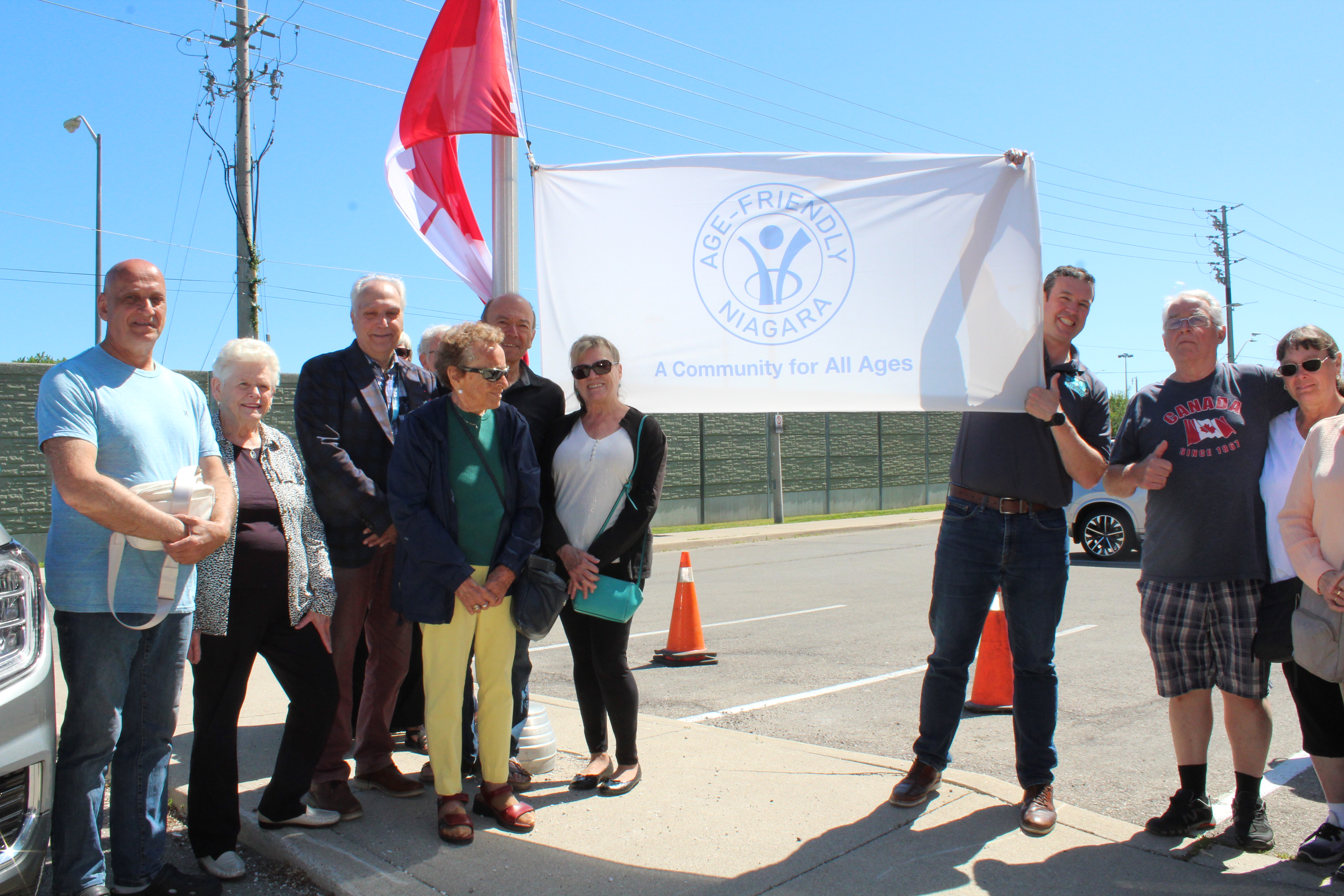 2026 June is Seniors Month flag raising Mayor Mat Siscoe readies to raise the Seniors Month flag on June 1, 2026 with members of the Older Adults Advisory Committee and older adults at the Dunlop Drive Older Adults Centre.