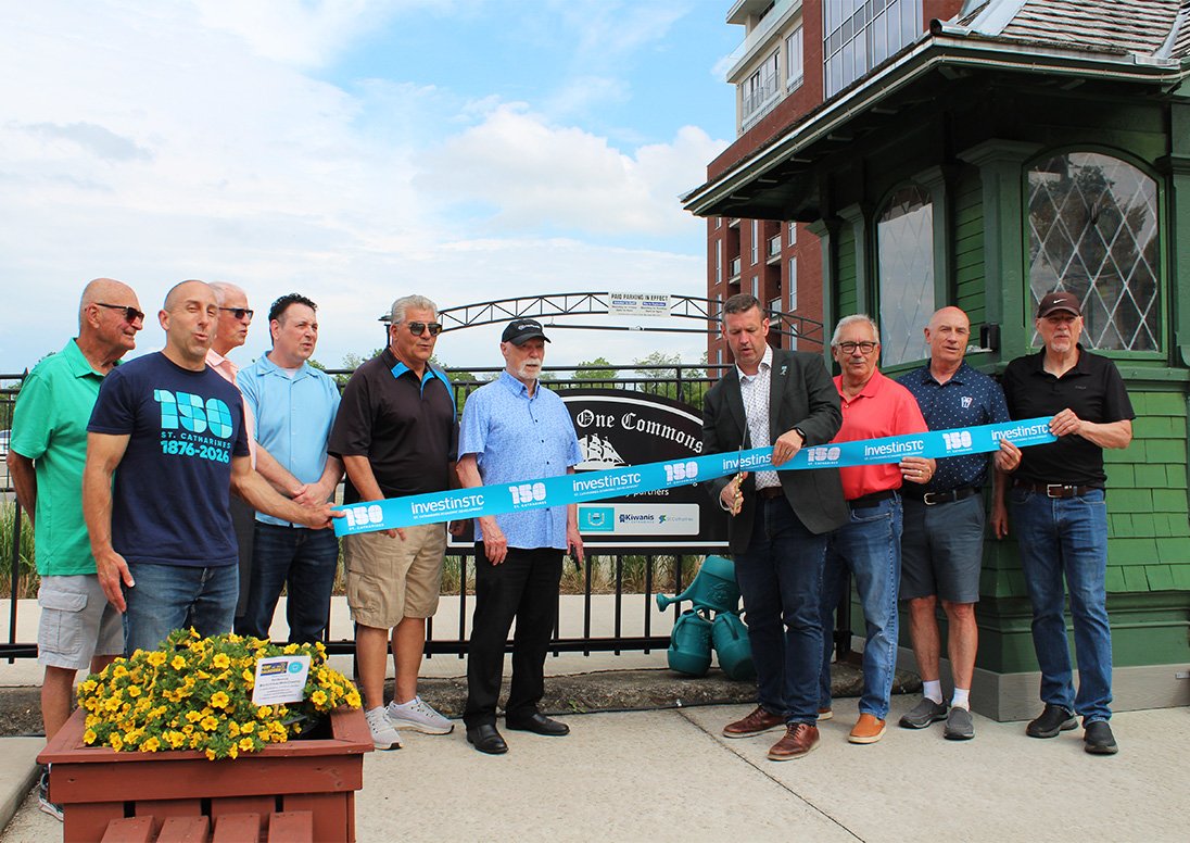 Mayor Mat Siscoe, Deputy Mayor Bill Phillips, Port Dalhousie Councillors Bruce Williamson and Marty Mako, and supporters including Kiwanis Club of St. Catharines members cut the ribbon on the 'Old Lock One Commons' permanent sign unveiled at the outdoor community and event space after residents were invited to provide naming suggestions for the space.