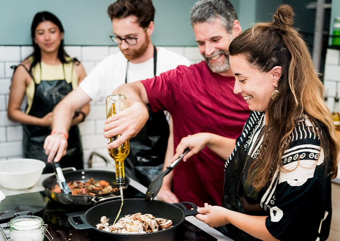 People participating in a cooking class.