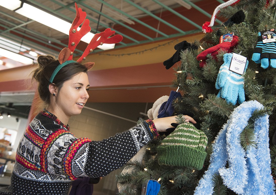 Museum staff decorating a tree