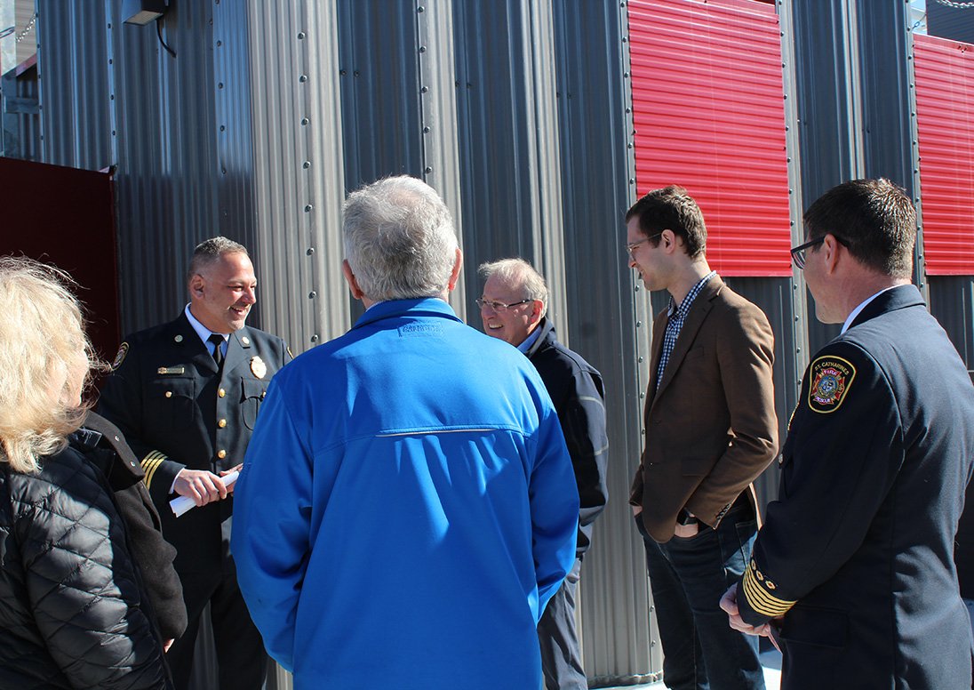 Deputy Fire Chief Trevor Parker leads a tour of St. Catharines Fire and Emergency Services' new training tower with Fire Chief Dave Upper and Ontario Solicitor General Michael Kerzner.