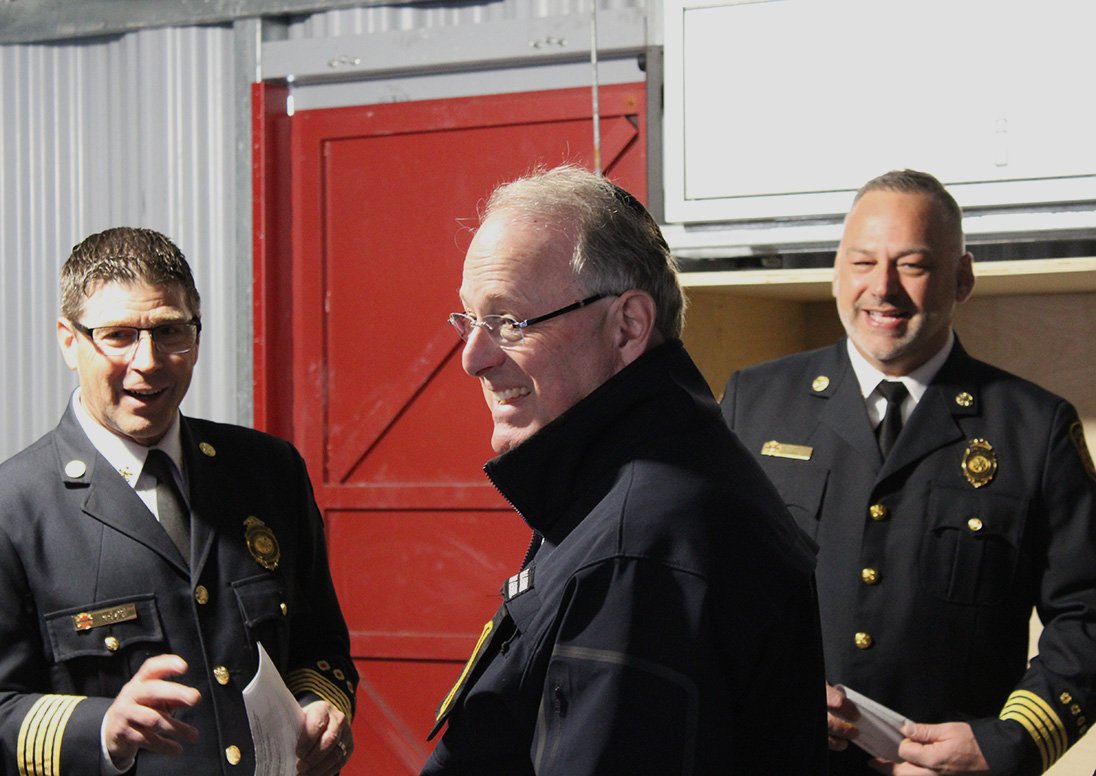 Deputy Fire Chief Trevor Parker leads a tour of St. Catharines Fire and Emergency Services' new training tower with Fire Chief Dave Upper and Ontario Solicitor General Michael Kerzner.