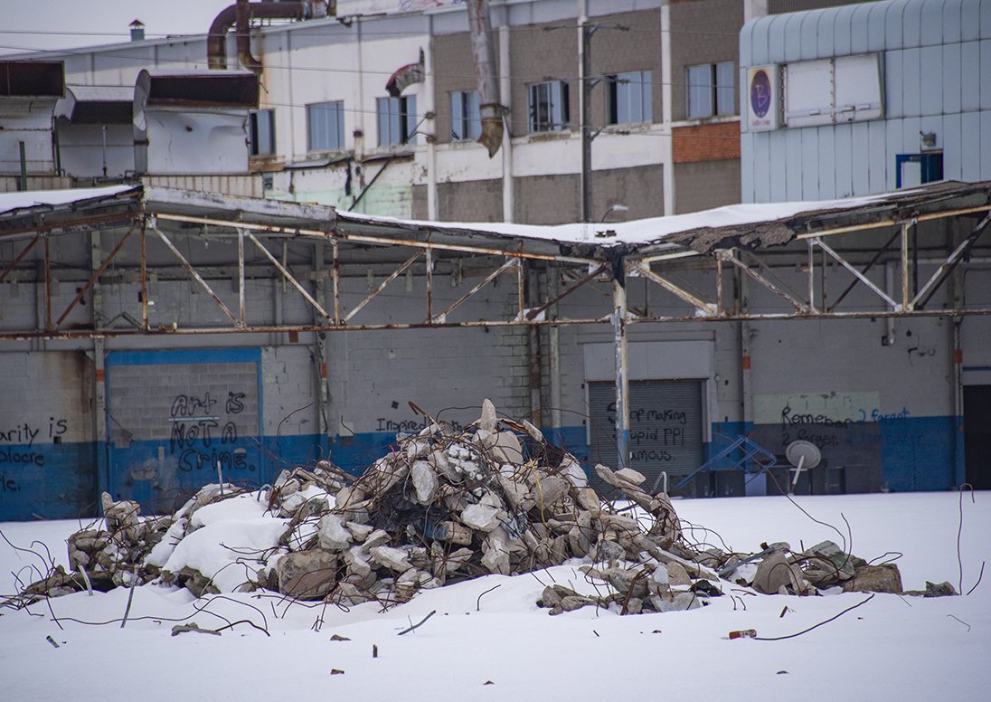 A pile of rubble and a dilapidated factory