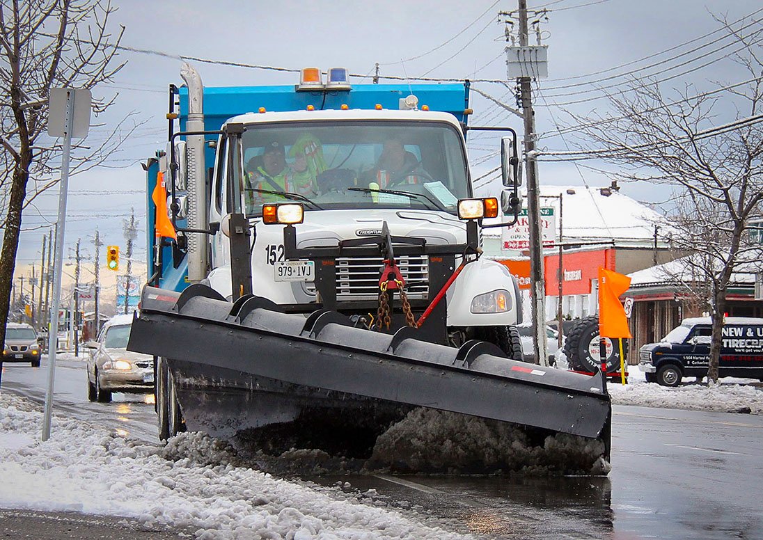 Plow clearing a City street