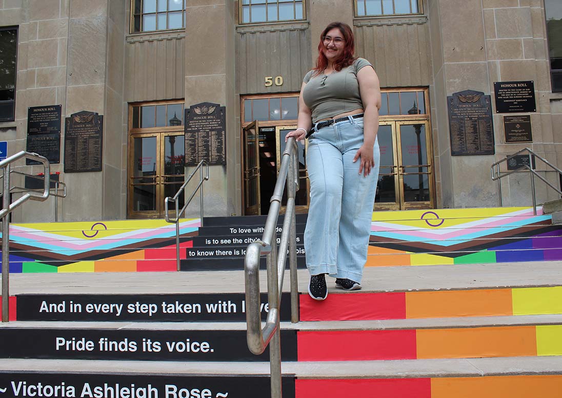 Poet Victoria Ashleigh Rose whose winning poem, To Love with Pride, was printed on vinyl alongside the Two Spirit Intersex Inclusive Pride Flag and installed on the front steps of City Hall, as part of a special exhibit called, 