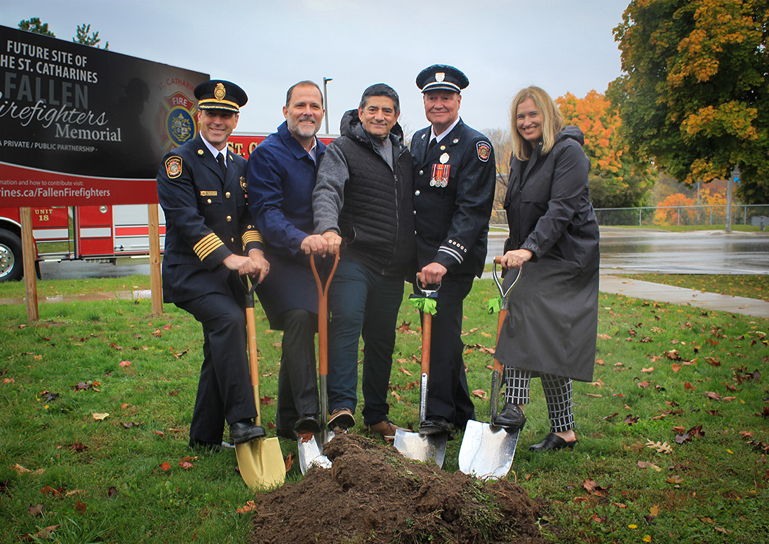 city officials and staff holding shovels to break ground on the new firefighter memorial