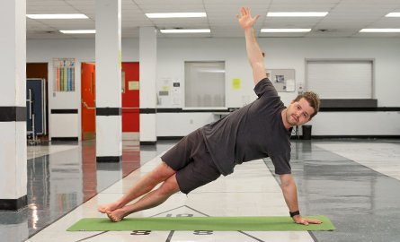 Man doing a side plank yoga pose