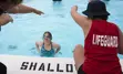 Girl receiving swimming instruction in a pool