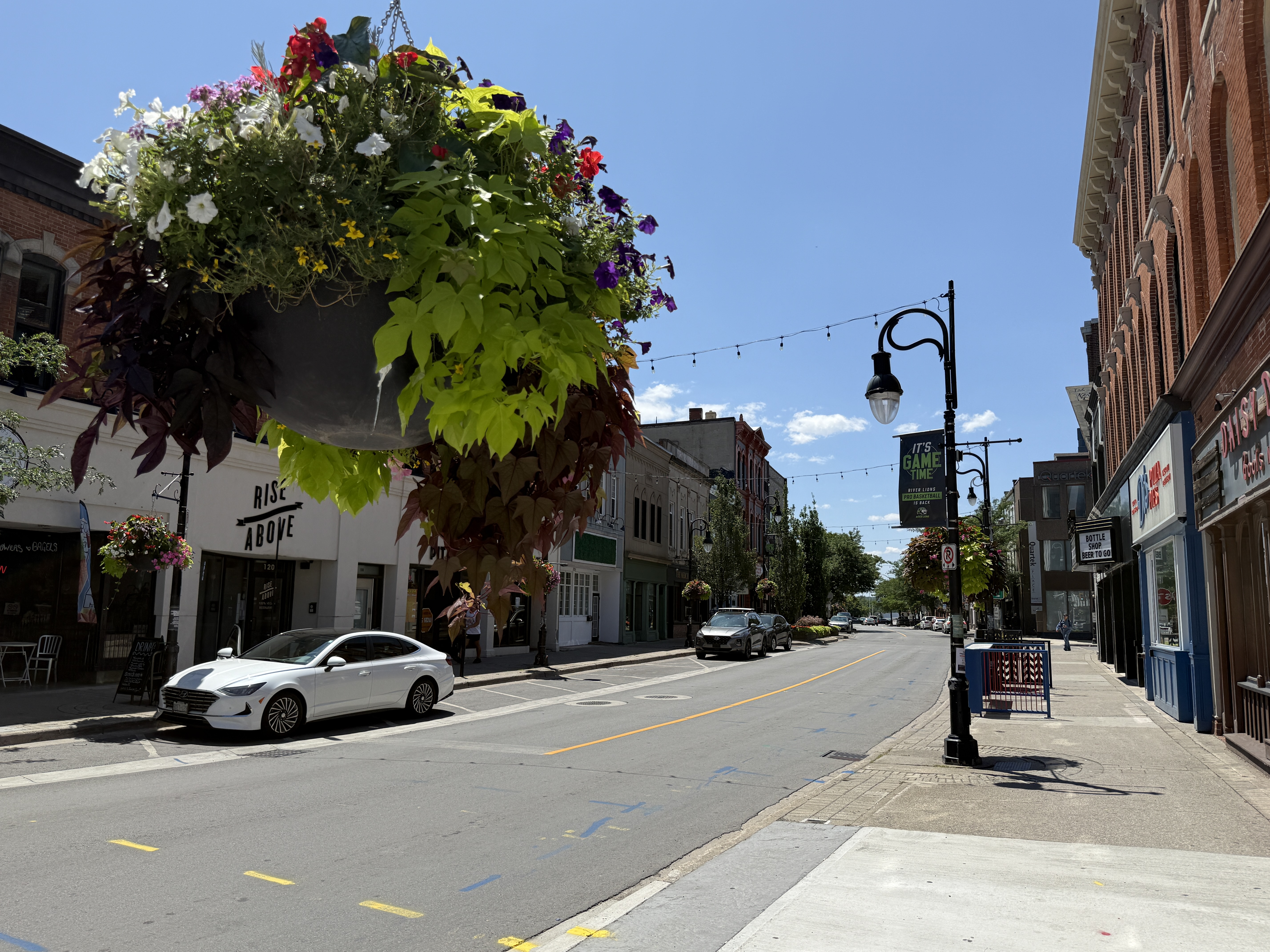 Cars parked and empty on-street parking spaces on St. Paul Street in downtown St. Catharines.